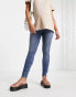 Фото #4 товара ASOS DESIGN Maternity ultimate skinny jeans in authentic mid blue with under the bump waistband