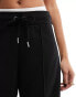 River Island wide leg side stripe jogger in black