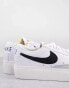 Nike Blazer Low Platform trainers in white and black