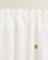 Curtain with pompoms