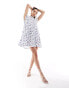 Фото #1 товара Wednesday's Girl tiered ditsy print mini smock dress in white and blue