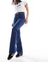 Urban Bliss buckle detail low rise bootleg jeans in mid wash blue