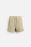 CREASED-EFFECT BERMUDA SHORTS