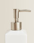 White earthenware bathroom soap dispenser