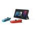 Фото #2 товара Nintendo Switch-Konsole mit einer neonroten Joy-Con und einer neonblauen Joy-Con