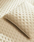 Quilted dotted cushion cover