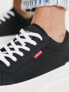 Levi's Malibu trainer in black with red tab logo