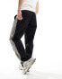 Фото #6 товара ASOS DESIGN baggy nylon track pants in black with grey side stripe