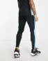 Nike Football Academy Dri-FIT panelled joggers in black blue and indigo