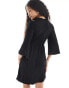 Фото #3 товара Vila Petite ribbed t-shirt mini dress with bell sleeve in black