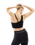 ellesse Playsol one shoulder crop top in black