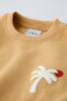 Embroidered palm tree sweatshirt