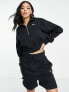 Nike mini swoosh quarter zip sweatshirt in black and sail