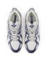 New Balance 610T trainers in blue and white