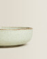 Porcelain bowl with antique finish rim