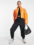 Missguided cropped vinyl puffer jacket in orange