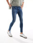 Фото #3 товара ASOS DESIGN spray on jeans with power-stretch in mid wash blue