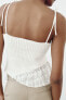 Contrast knit top with cutwork embroidery