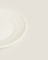 Earthenware side plate with raised-design edge