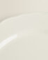 Earthenware dinner dish with raised-design edge