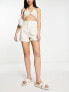 In The Style x Gemma Atkinson high waist tailored shorts in ecru