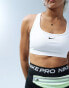 Nike Training Swoosh light support sports bra in white