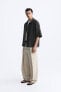 WIDE-FIT PLEATED TROUSERS