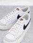 Nike Blazer Low Platform trainers in white and black