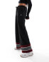 Фото #1 товара ellesse Tricia wide leg track pants in black