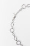 Chain link necklace with metal torso