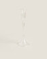 Raised design glass candlestick