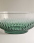 Glass bowl with raised design