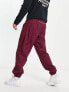 Фото #2 товара Nike Circa Premium winter textured casual trousers dark beetroot red