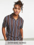 Фото #1 товара ASOS DESIGN relaxed polo shirt in navy & brown stripe