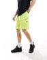 The North Face logo pocket shorts in lime