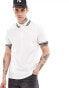 ASOS DESIGN pique polo shirt in cream with black tipping