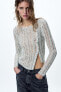 Asymmetric open-knit sweater