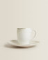 Stoneware coffee cup and saucer