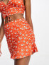 ASOS DESIGN co-ord flippy skirt with side ruching in orange red floral