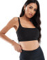 ASOS 4505 soft touch medium support sports bra with removable padding in black