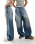 Weekday Unisex Astro loose fit wide leg jeans in streaky blue wash