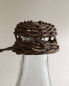 Glass bottle with rattan stopper