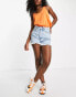 Waven high rise distressed denim shorts with side slit in light blue