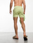 ASOS DESIGN skinny shorts in shorter length in green