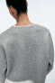 Cropped knit sweater with contrast topstitching