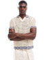 ASOS DESIGN knitted crochet notch neck polo in ecru with contrast trims