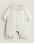 Children’s romper with embroidered floral collar