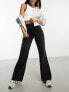 Фото #2 товара COLLUSION x008 mid rise relaxed flare jeans in washed black