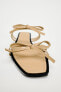 Flat slider sandals with bows