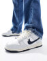 Nike Dunk Low Retro trainers in white and blue